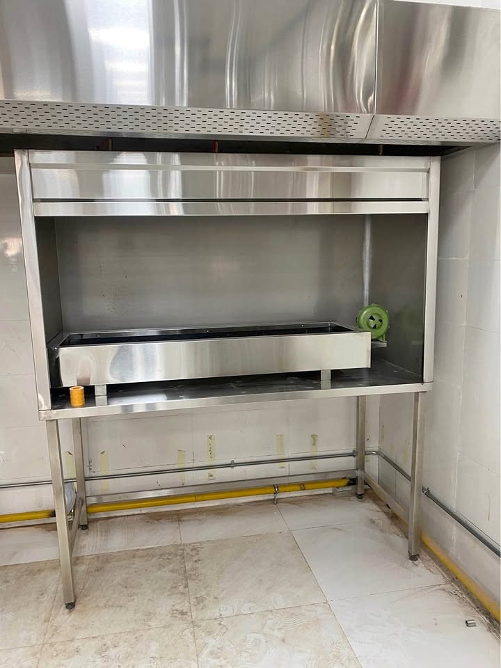 Commercial kitchen hood and cooking station